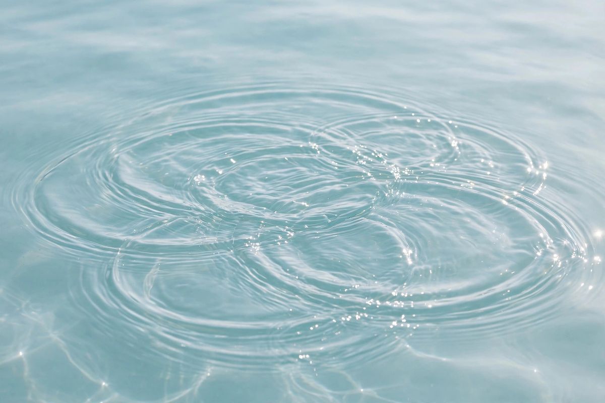 Clear blue water surface with soft ripples, used as the guides section background